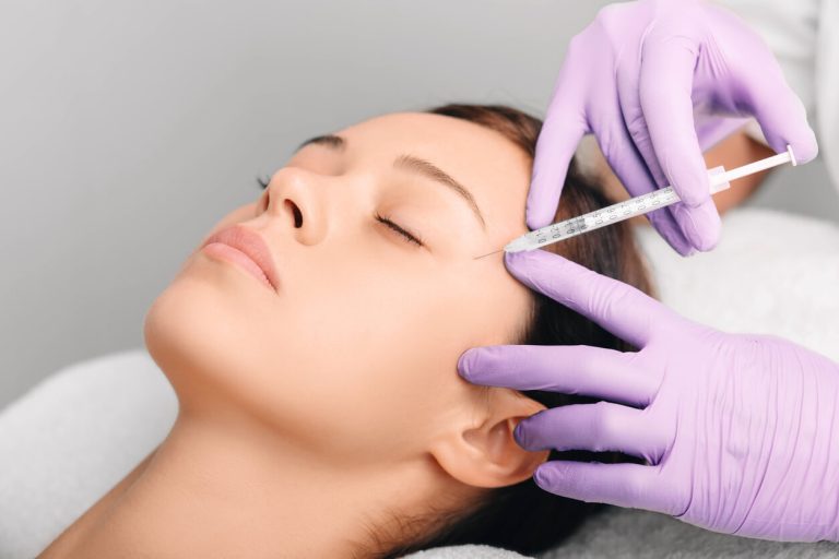 Beautiful woman having facial injection, wrinkle removing.