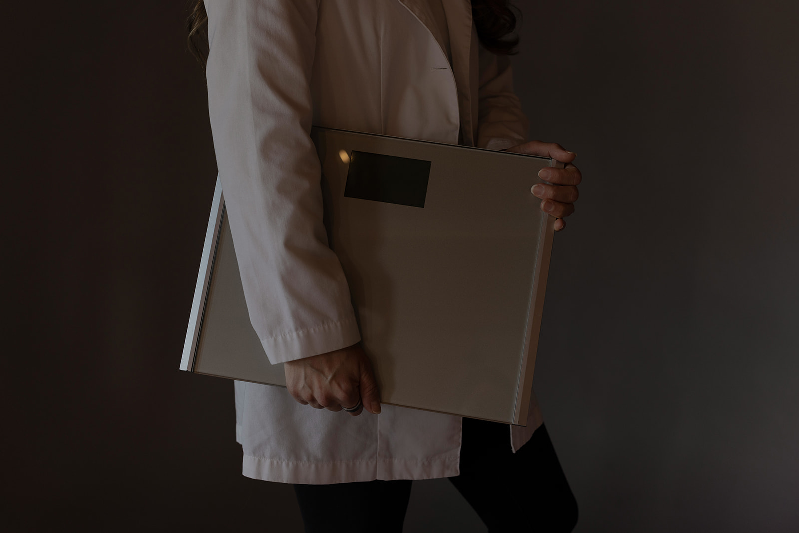 doctor holding scale