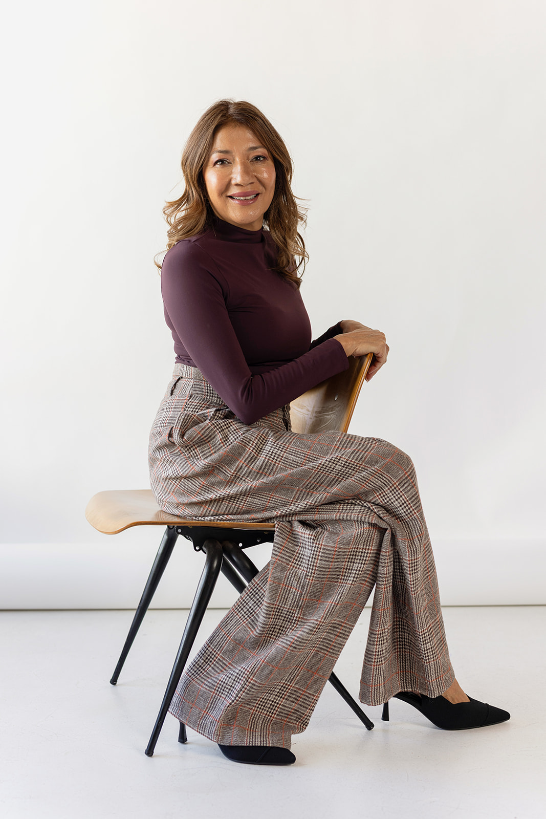 Fitness Trainer Gabie sitting in a chair